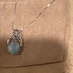 Turquoise stone pendent on silver necklace